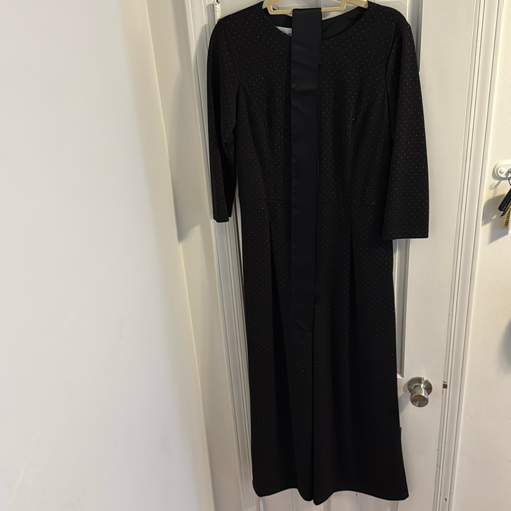 Black, with glittery polkadot, jumpsuit. three-quarter length sleeve
